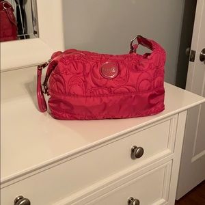 Pink Coach purse discounted due to imperfections